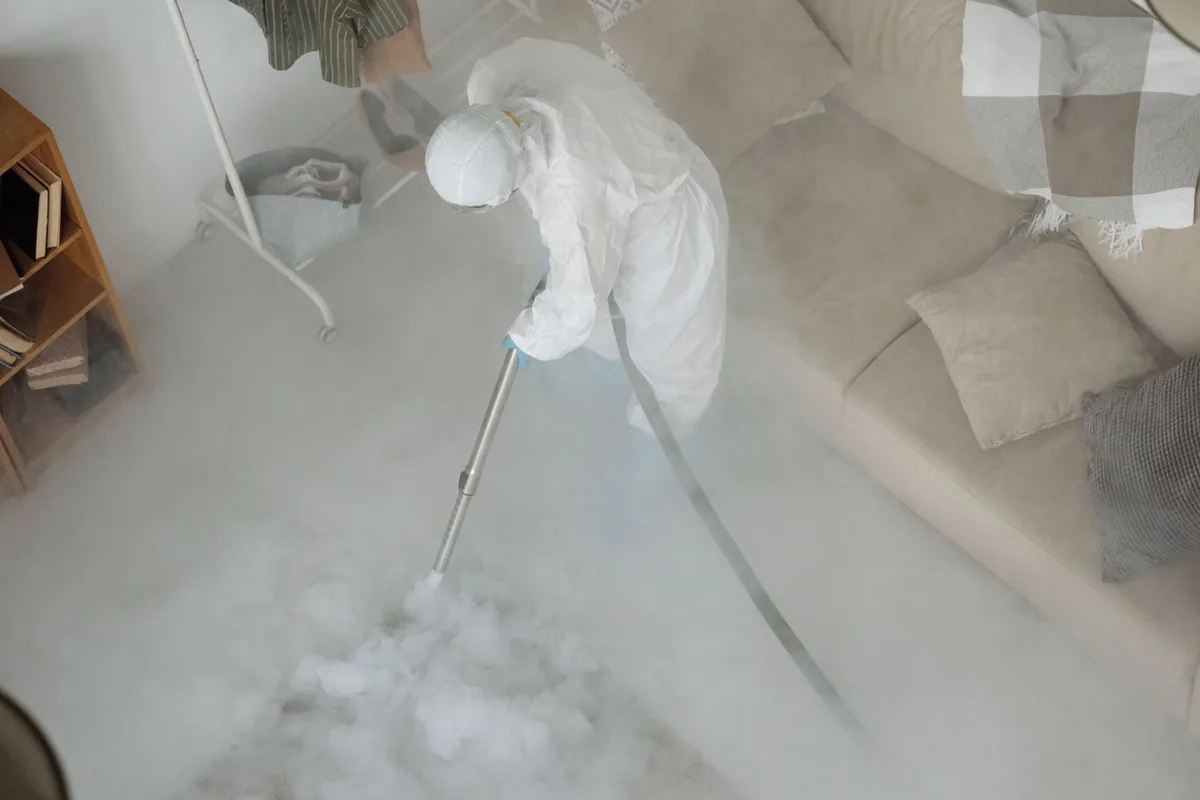 Biohazard cleanup technician in protective equipment, West Liberty, OH